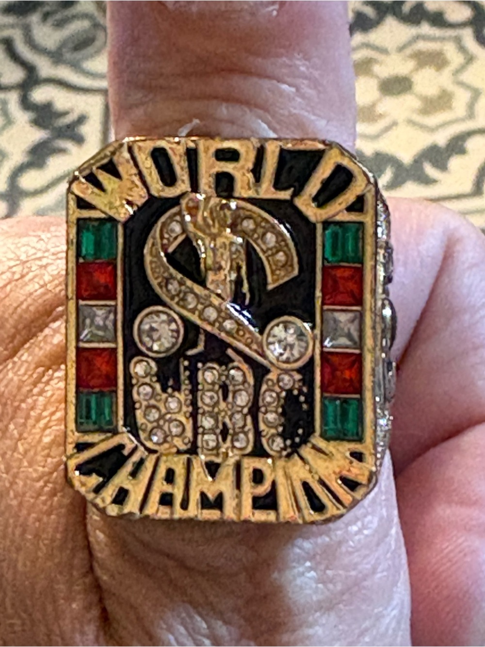 World Champion Statement Ring in Gold with Red & Green Accents